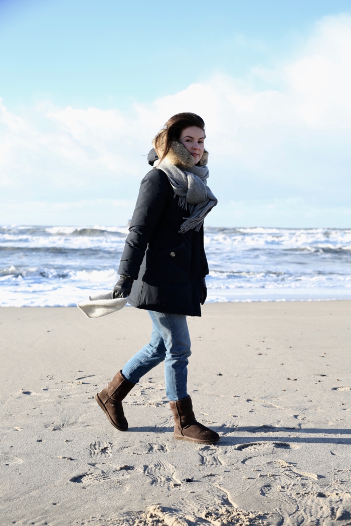 walk at the beach, winter parka, jeans, boots