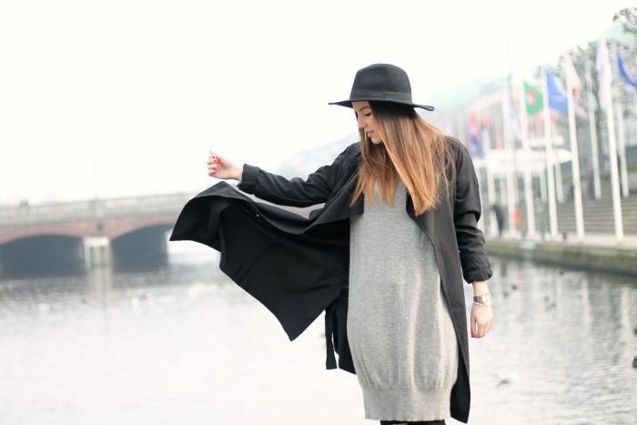 Black Coat and grey sweater with black hat